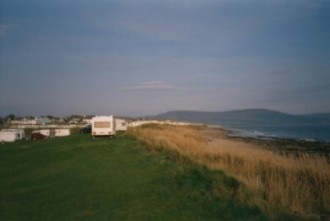 Touring caravans pitched on the sea front